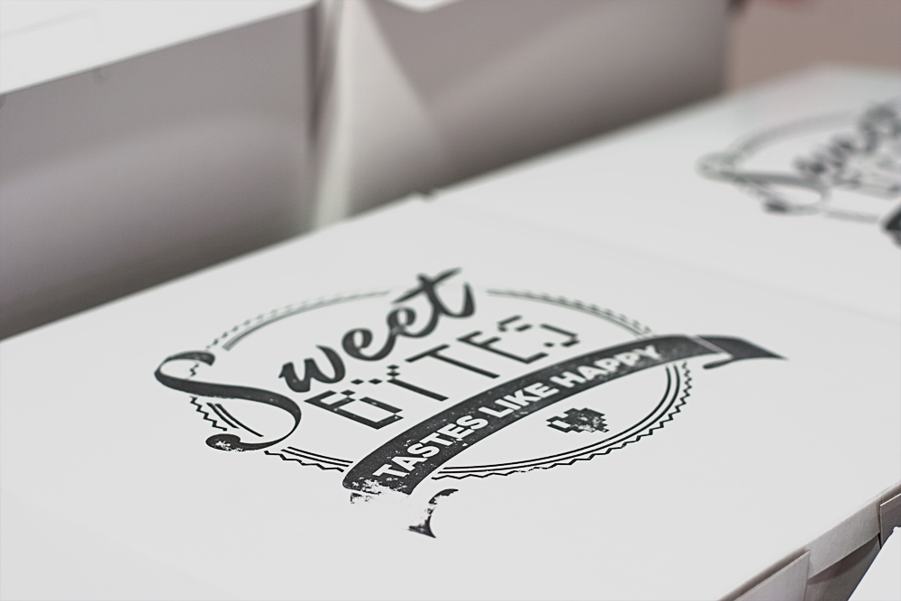 close up of sweet bytes home bakery box with logo stamped on top