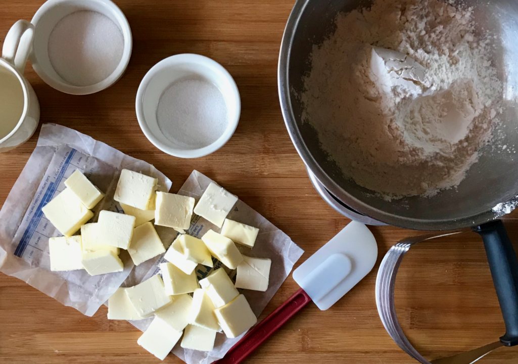 baking ingredients and ready to soften butter on a cutting board