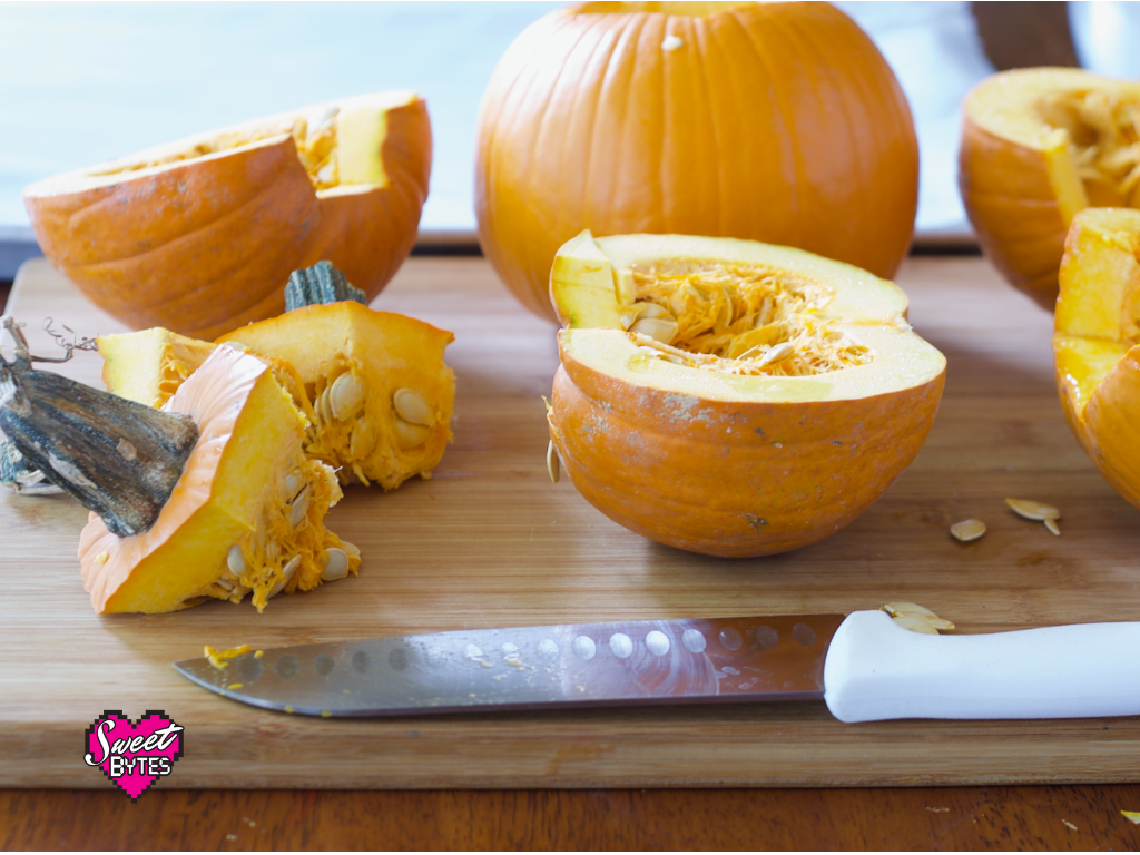 Pumpkins for pie cut in half with stems removed