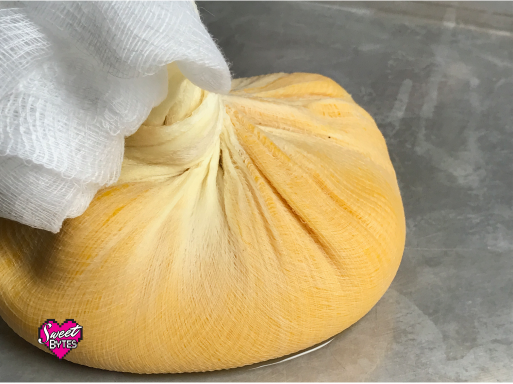 Pumpkin for pie in cheesecloth ready to be strained