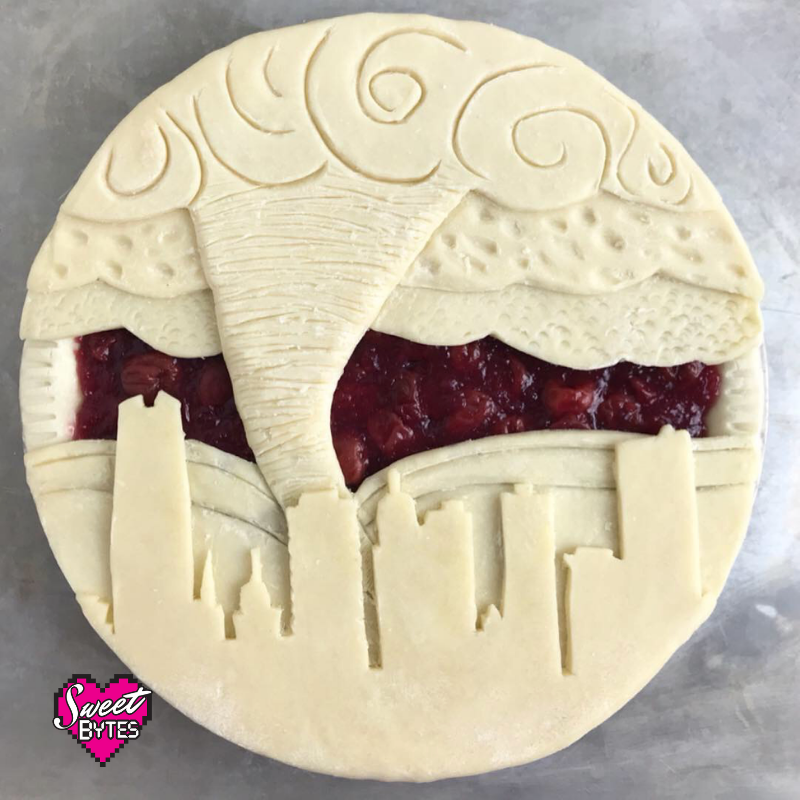 Finished raw OKC pie with downtown Oklahoma City with a tornado made out of pie crust