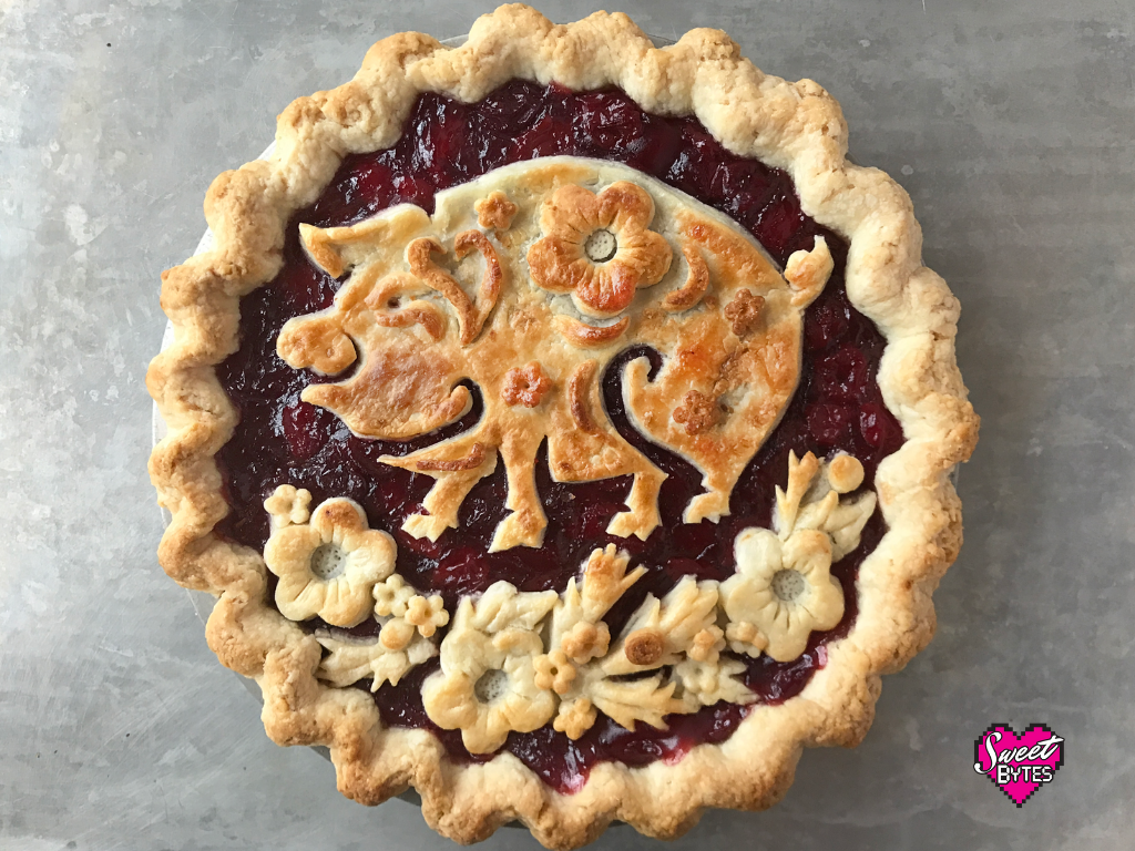 Baked year of the pig pie with pie crust flowers at the bottom