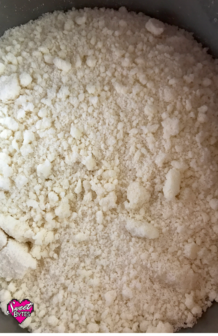 Crumbs formed by mixing dry cake ingredients with butter for the reverse creaming method of baking a cake