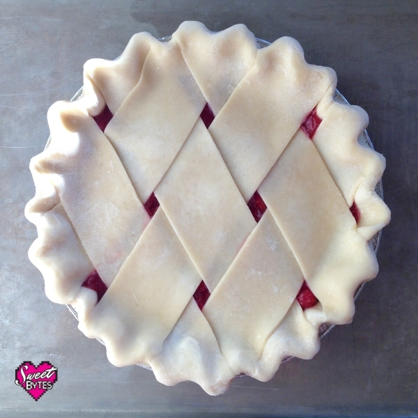 Uncooked pie with a fat lattice pie crust from scratch