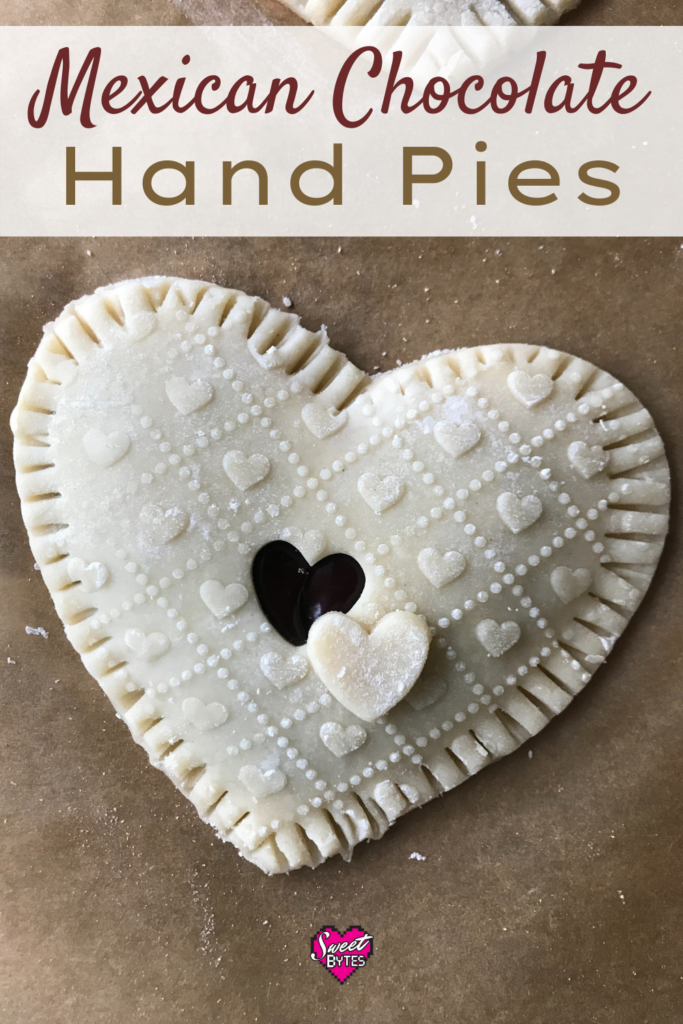 A heart-shaped Mexican chocolate hand pie on a brown parchment paper