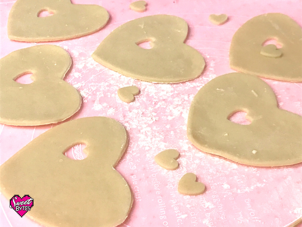 hearts cut out of pie crust to make heart-shaped hand pies