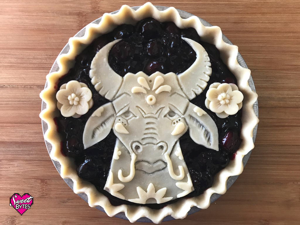 Unbaked pie, an ox made out of pie crust decorations for Lunar New Year