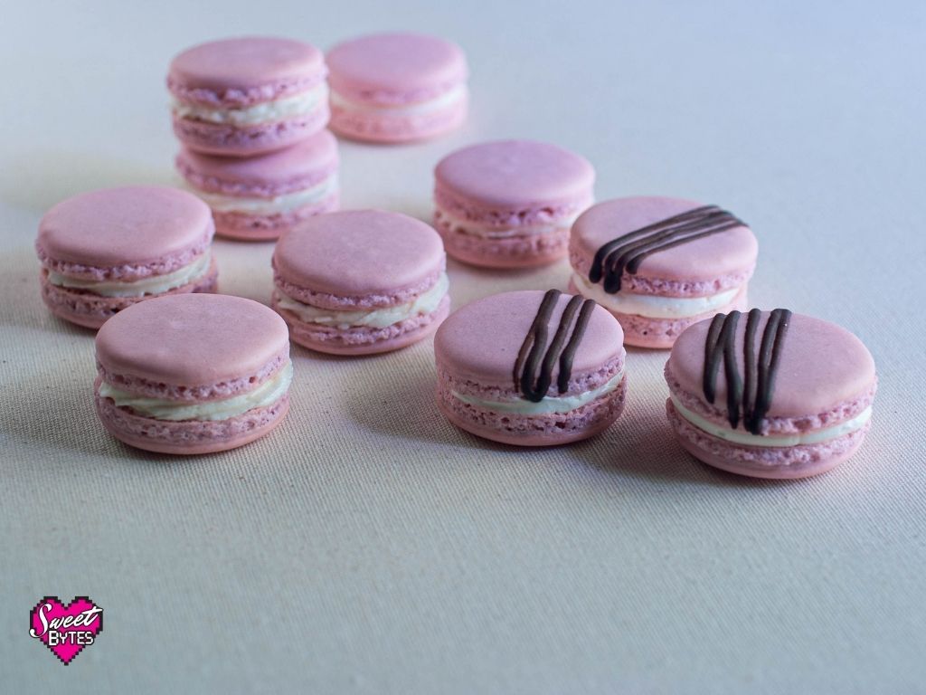 Pink French macarons on white table cloth