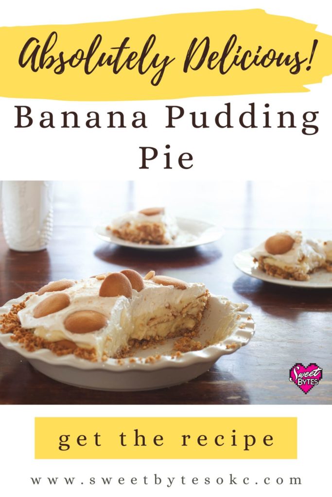Graphic Image for Pinterest of Absolutely Delicious Banana Pudding Pie with an image of a sliced pie in a white pie plate sitting on a wooden table with two slices of pie of white saucers behind the sliced pie.