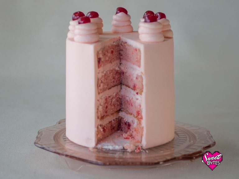 Cherry Chip layer cake with a slice missing